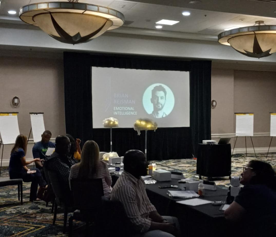 Brian Reisman leading a workshop in a conference room